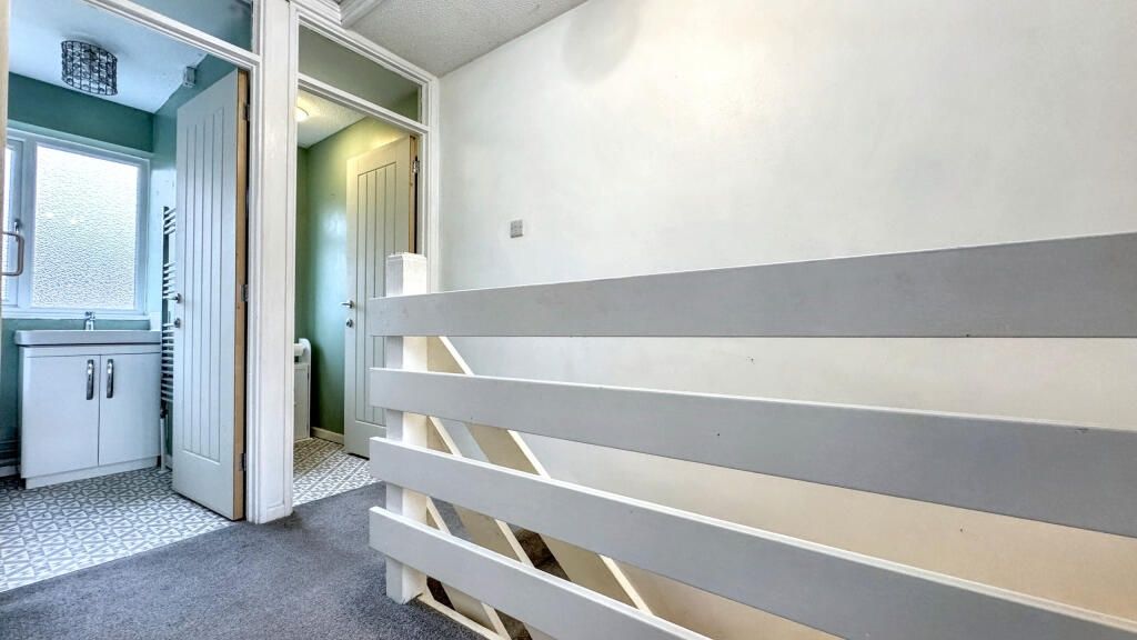 Property photo 3 of 14 A Bright And Tidy Hallway Featuring A Modern White...