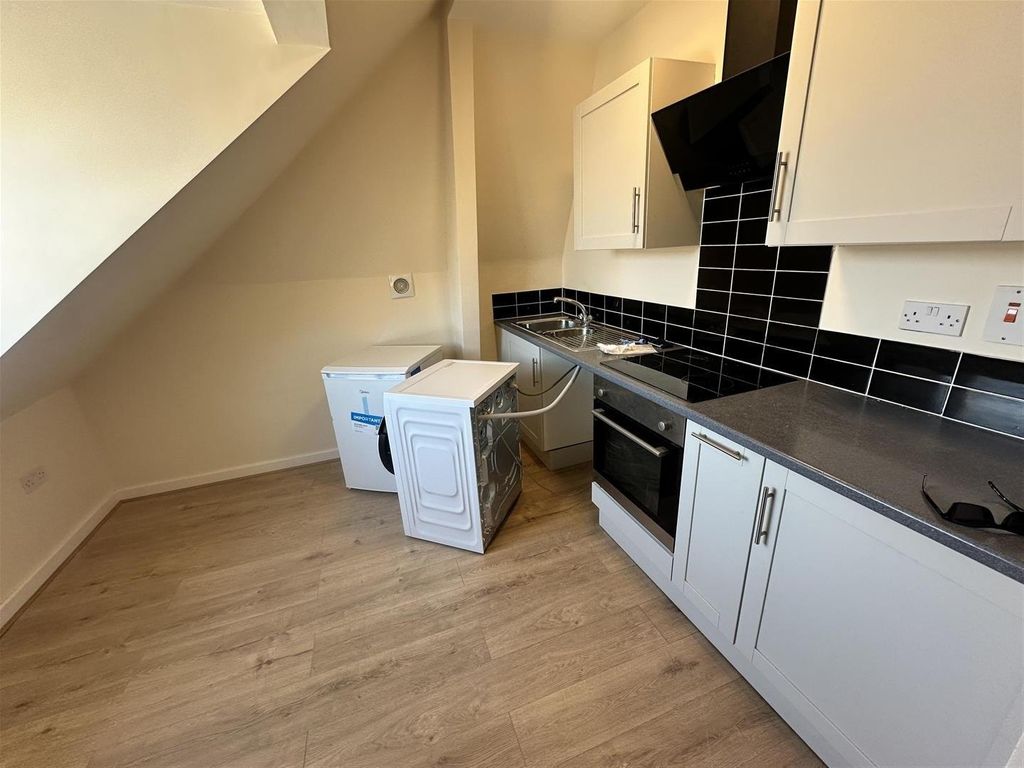 Property photo 1 of 5 Modern Kitchen With Sleek Black Tiling...