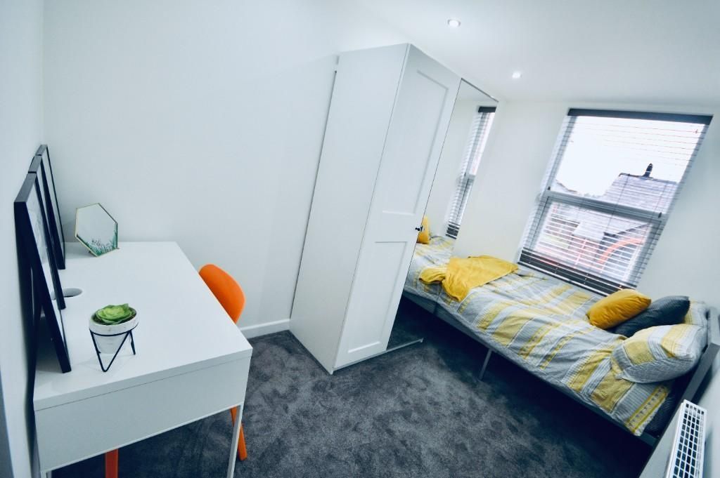 Property photo 1 of 12 A Bright And Well-Kept Bedroom Featuring A Comfort...