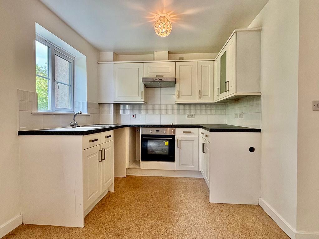 Property photo 2 of 12 Kitchen Area