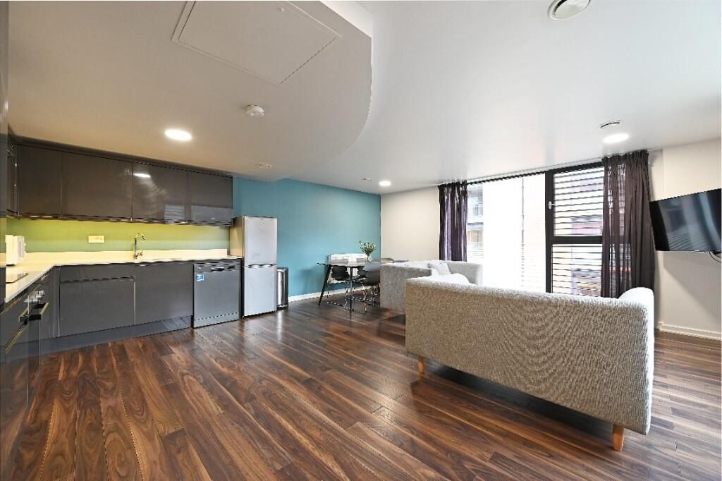 Property photo 3 of 12 Modern Living Room With A Sleek Kitchen Area, Styl...