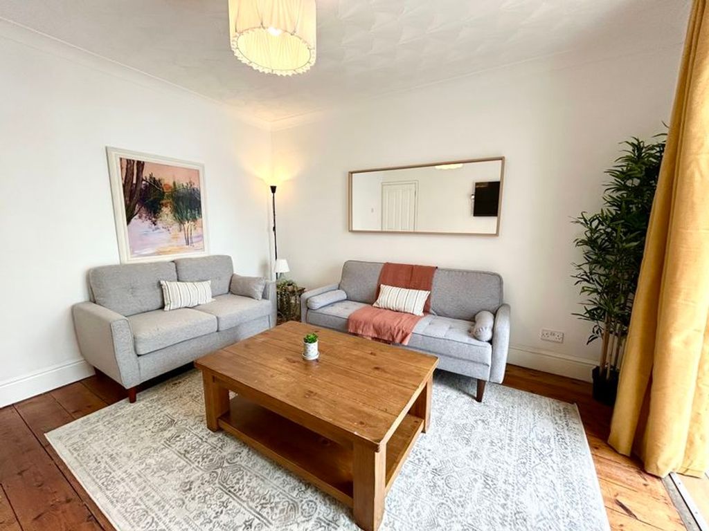 Property photo 3 of 8 A Bright And Inviting Large Modern Living Room Per...