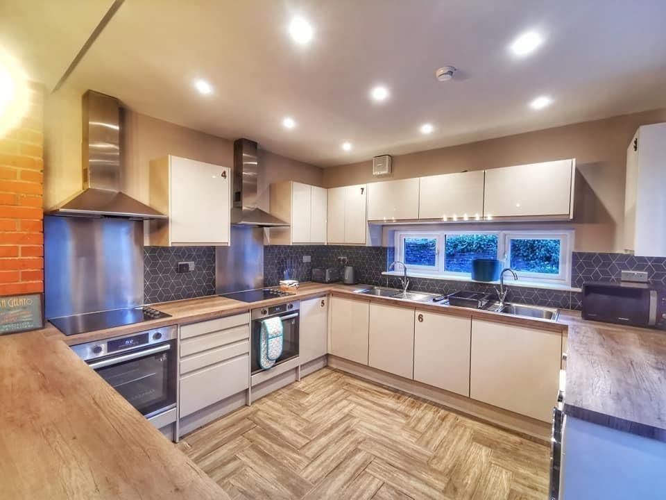Property photo 3 of 8 Modern Spacious Kitchen With Sleek Appliances...