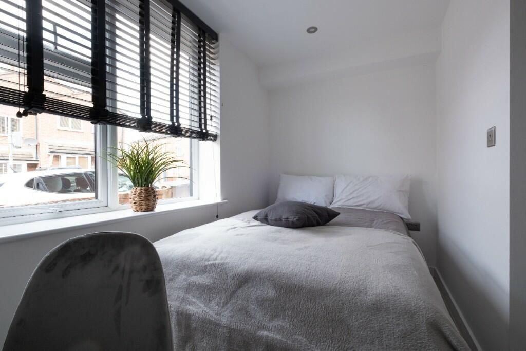 Property photo 1 of 11 A Bright And Tidy Master Bedroom With A Large Wind...