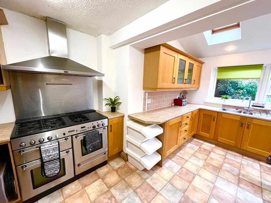 Property photo 3 of 6 Spacious And Well-Equipped Kitchen Featuring Ample...