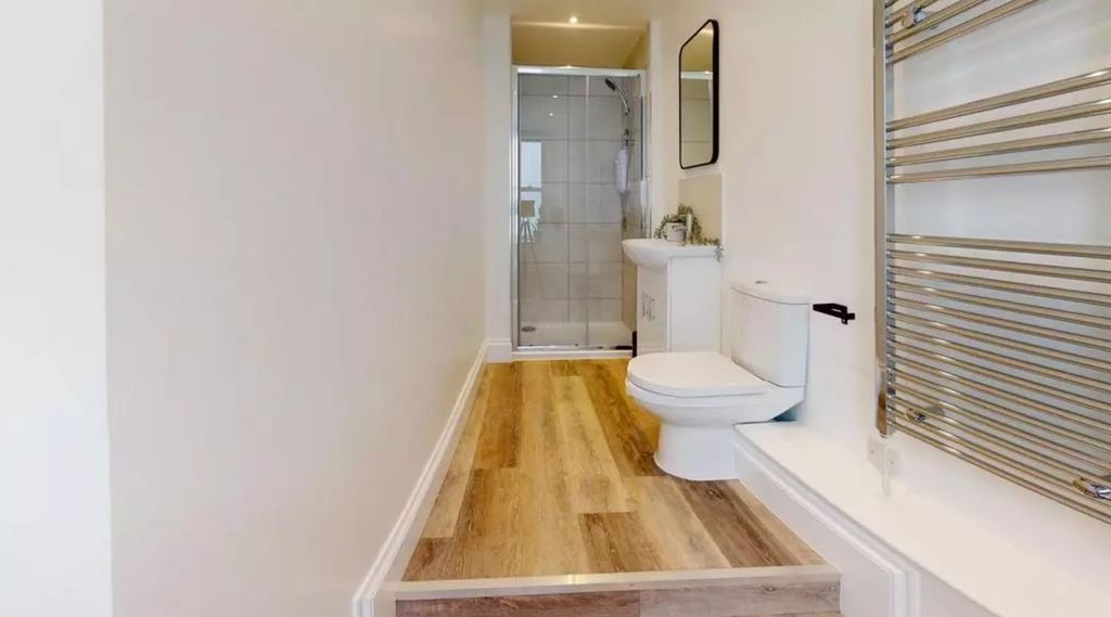 Property photo 1 of 9 A Modern And Clean Bathroom Featuring A Shower And...
