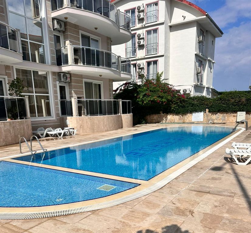 Property photo 1 of 16 Renovated Belek Apartment In Antalya For Sale - View Of The Apartment Block And Swimming Pool