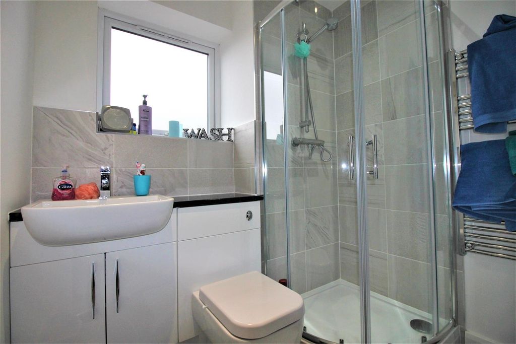 Property photo 3 of 7 Modern Bathroom With Sleek Walk-In Shower...