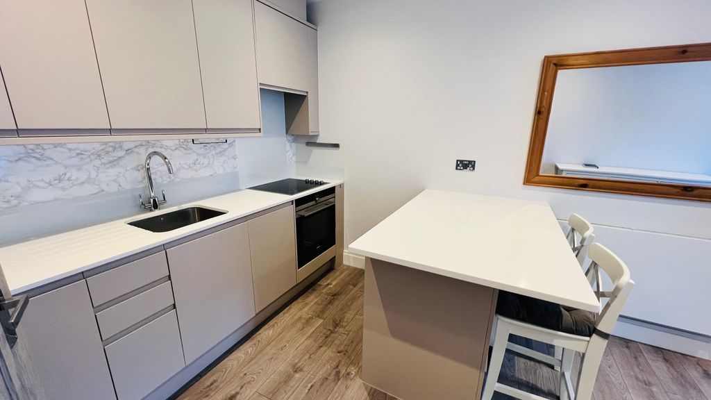 Property photo 3 of 12 Kitchen