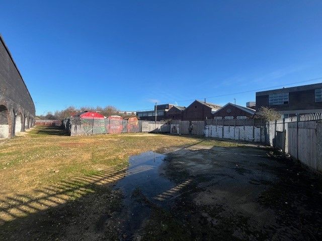 Property photo 2 of 3 An Open Yard With Metal Fencing Around It.