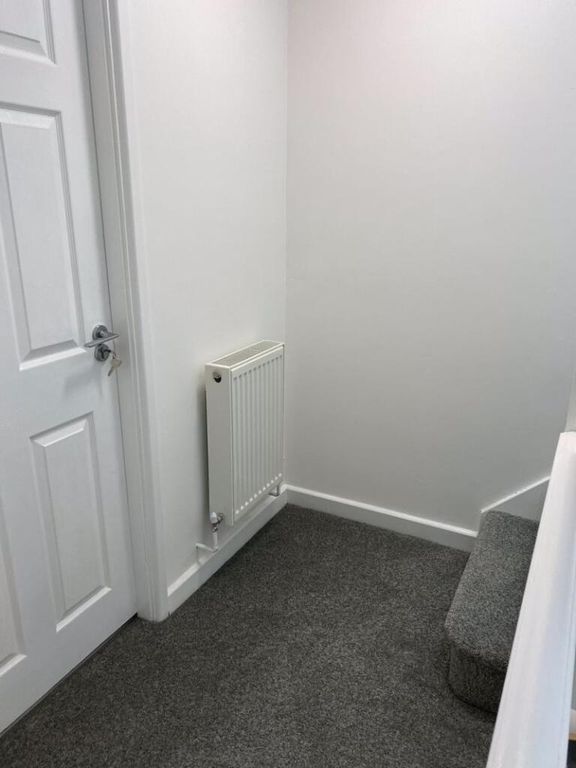 Property photo 2 of 13 A Clean And Well-Maintained Hallway Featuring Neut...