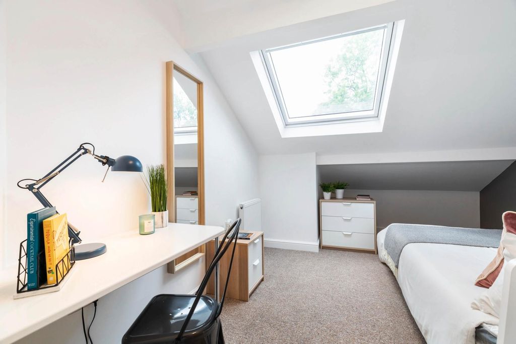 Property photo 2 of 12 A Bright And Welcoming Living Room With Ample Natu...