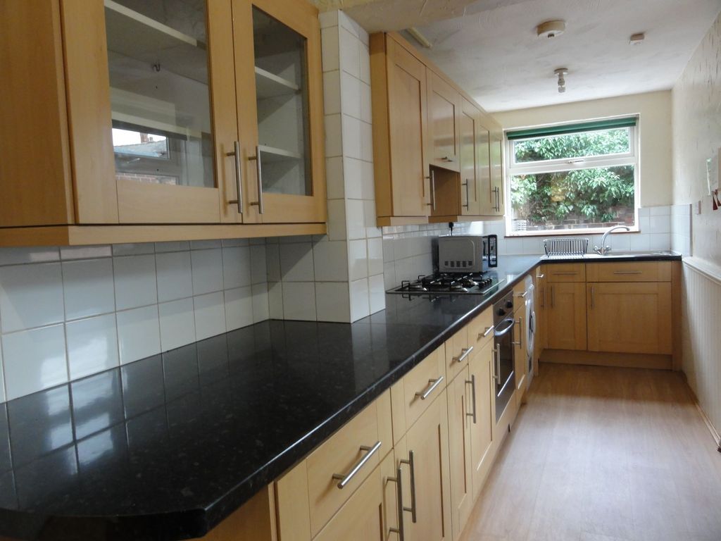Property photo 3 of 11 Bright Galley Kitchen With A Long Black Granite-St...