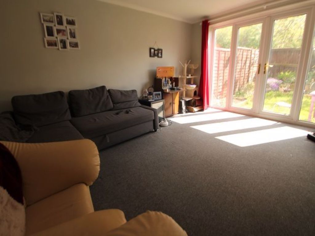 Property photo 2 of 9 A Bright And Inviting Living Room With Large Glass...