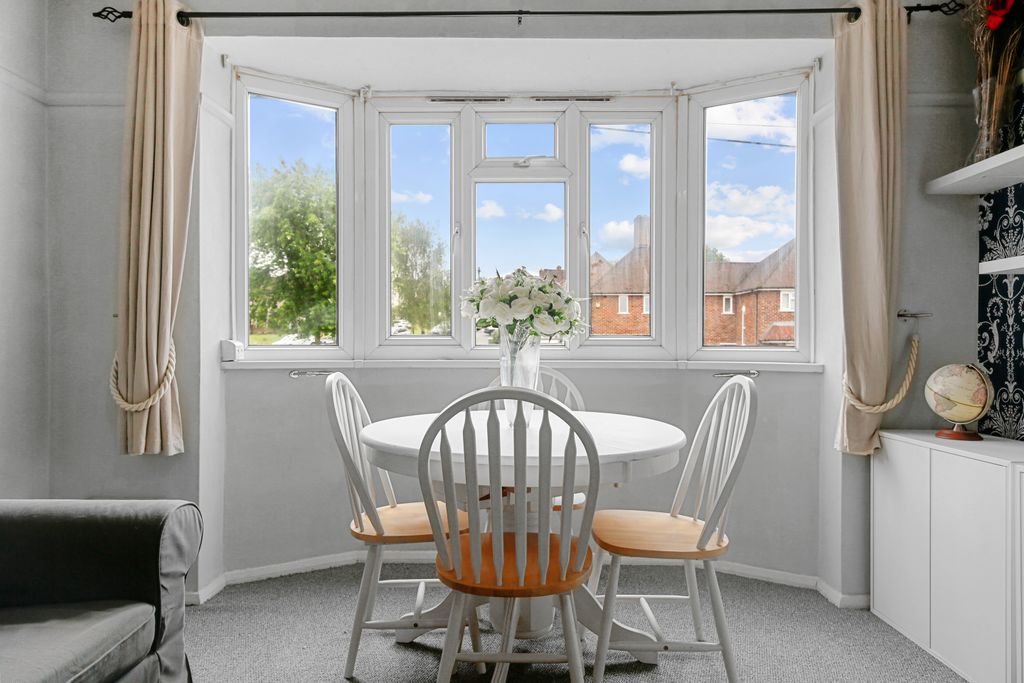 Property photo 3 of 34 Bright And Inviting Dining Space Framed By A Wide Bay Window.