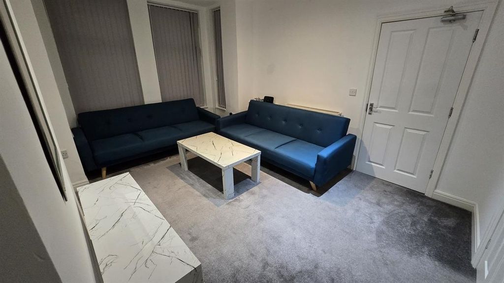 Property photo 3 of 13 A Contemporary And Welcoming Living Room Featuring...