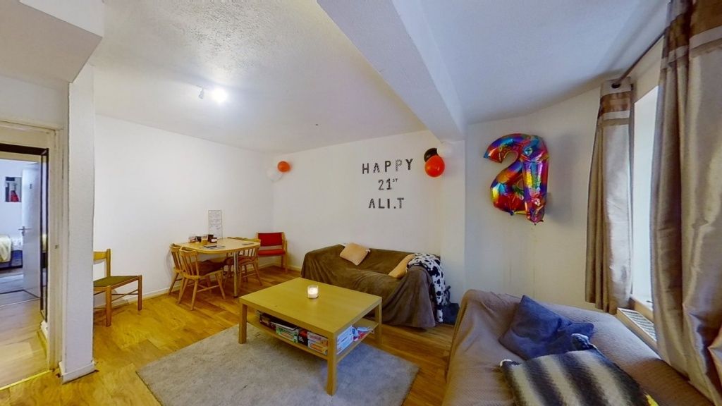 Property photo 3 of 11 A Cozy And Inviting Living Room Featuring A Comfor...