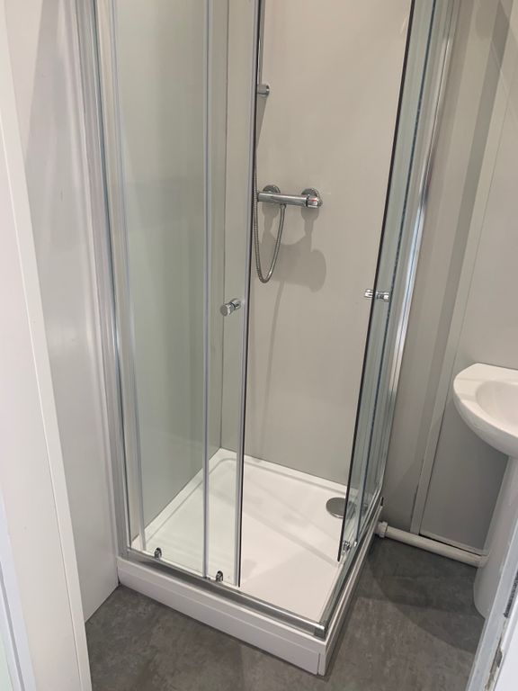 Property photo 3 of 3 Modern Shower Area Featuring Sleek Glass Doors And...
