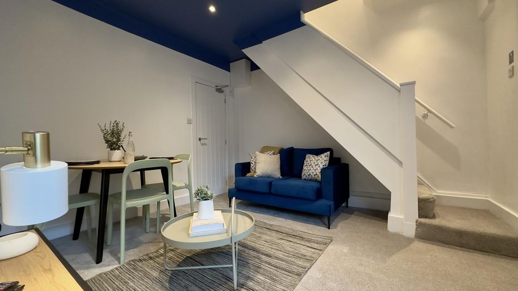 Property photo 2 of 8 A Stylish And Inviting Living Room With Modern Dec...