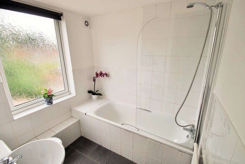 Property photo 3 of 18 A Modern Bathroom Featuring A Spacious Bathtub And...