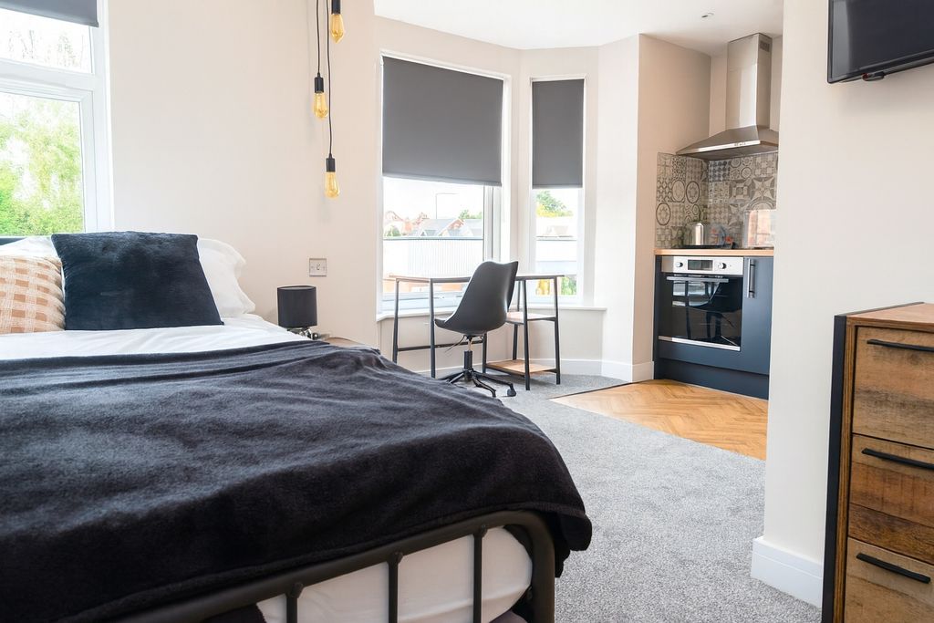 Property photo 2 of 5 Bright And Modern Living Space Featuring Large Win...