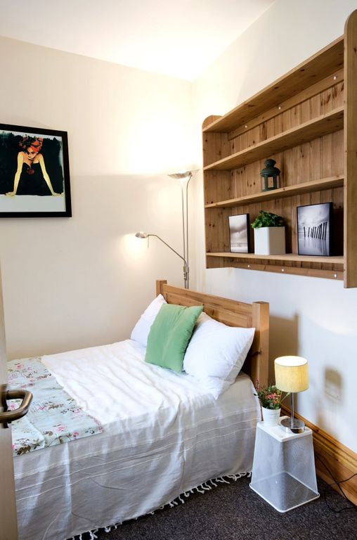 Property photo 1 of 17 Cozy Single Bedroom Featuring A Neatly Made Bed Wi...