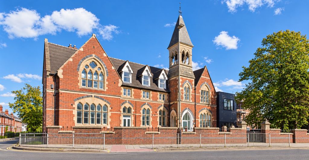 Property photo 1 of 7 Red Brick Tower Under Blue Sky