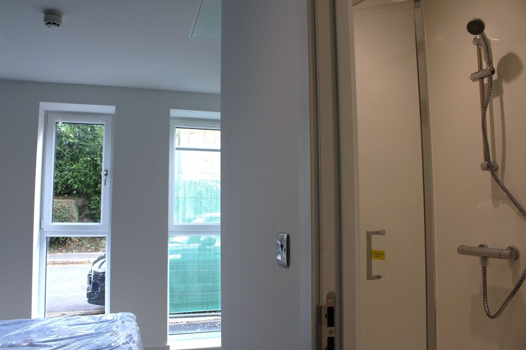 Property photo 2 of 3 A Bright And Modern Bathroom Featuring Large Windo...