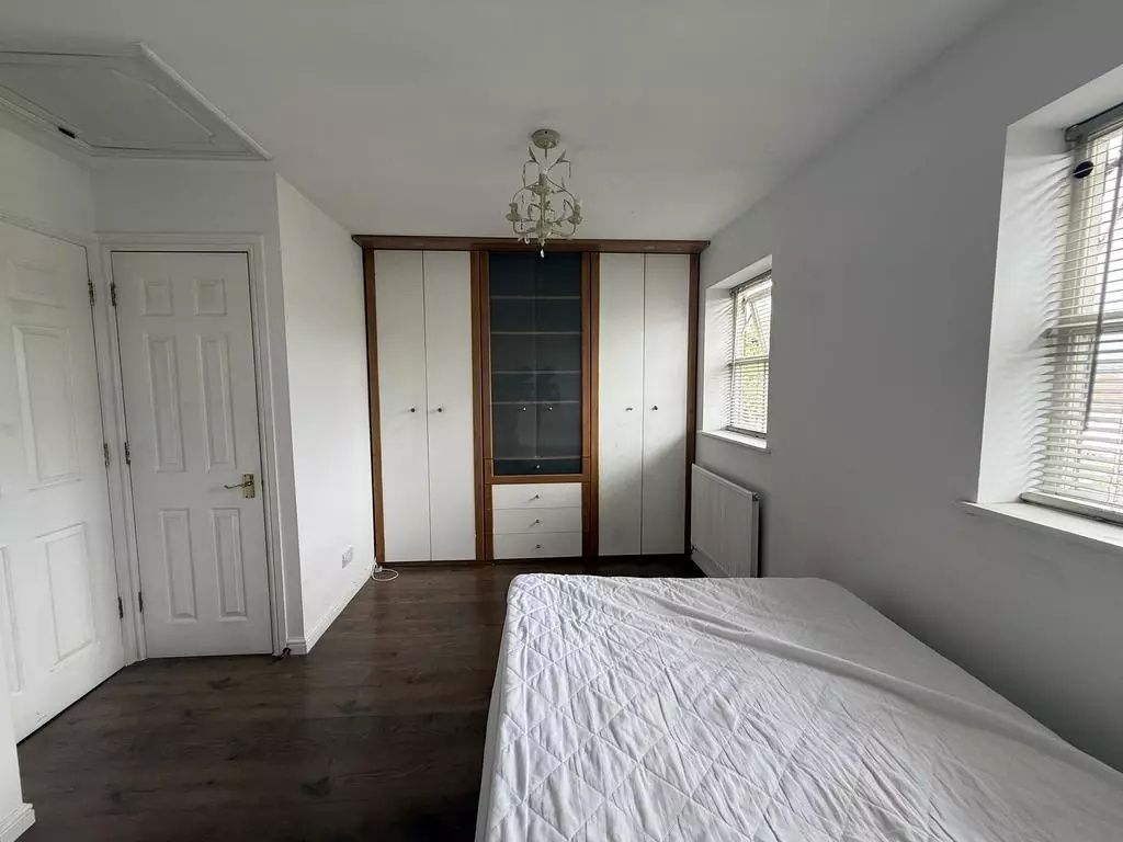 Property photo 2 of 13 Bright Master Bedroom With Ample Built-In Storage...