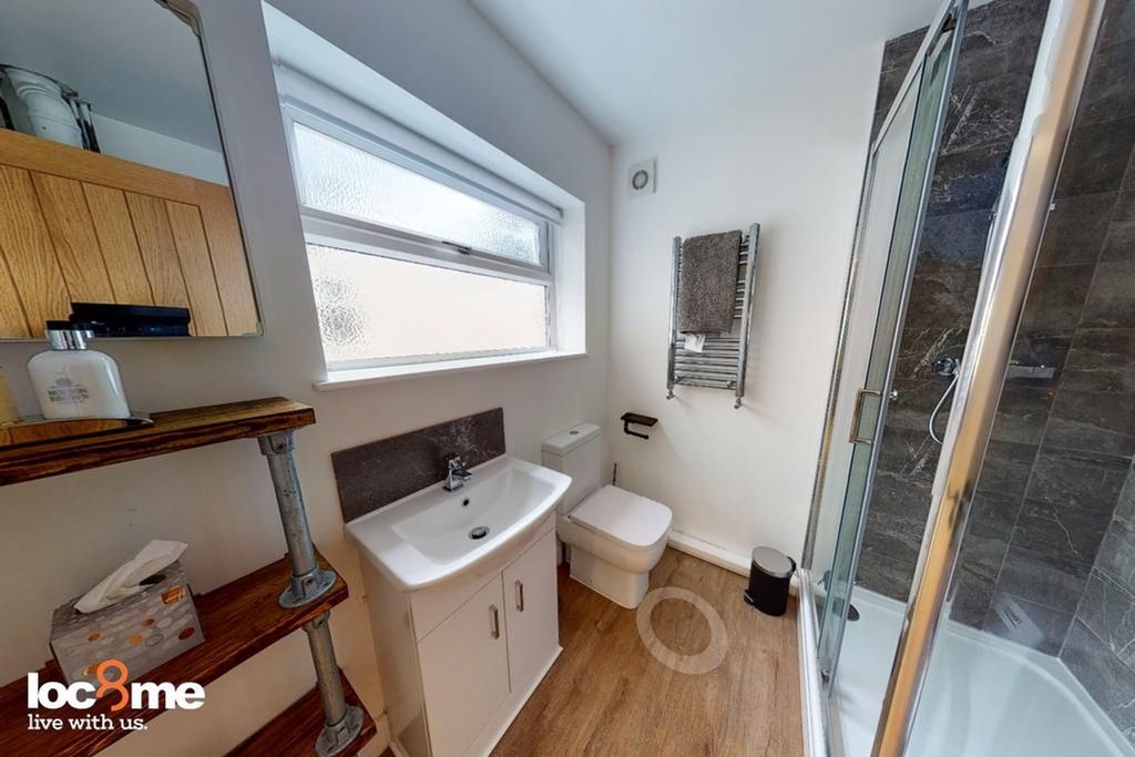 Property photo 2 of 12 A Modern And Tidy Bathroom Featuring A Spacious Sh...