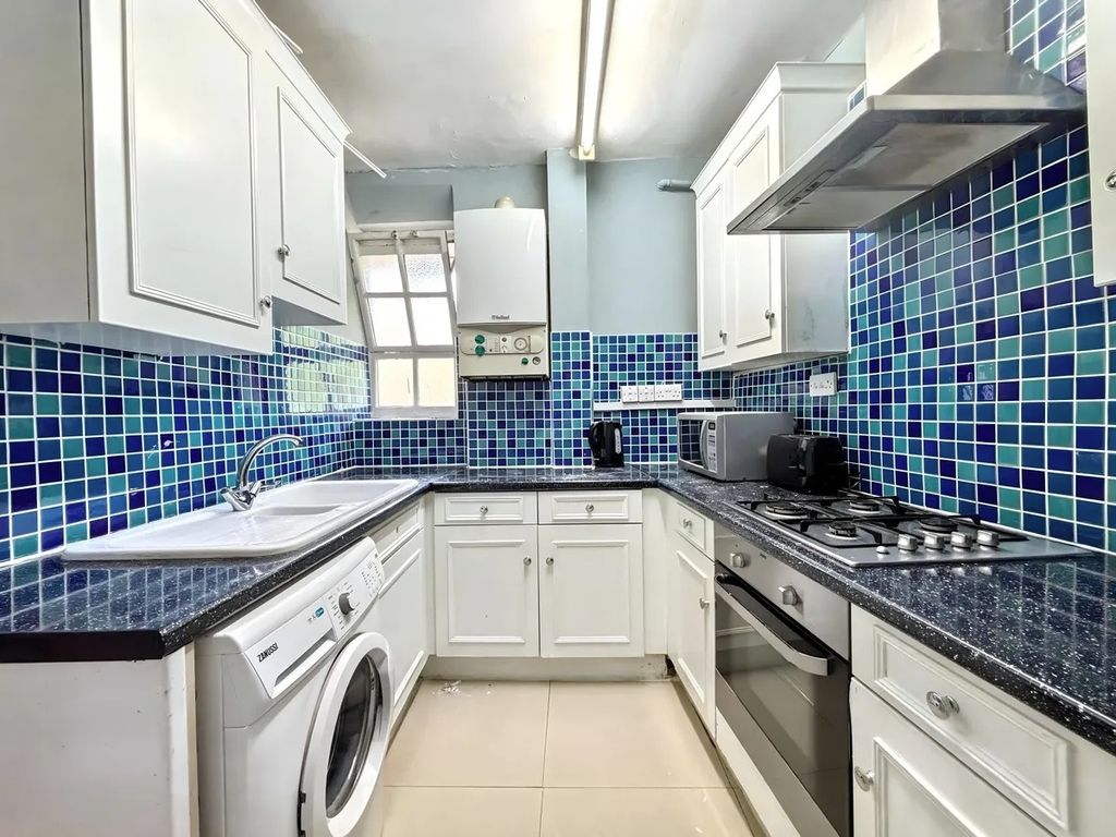 Property photo 1 of 8 Bright Kitchen With Vibrant Blue Mosaic Tiles...