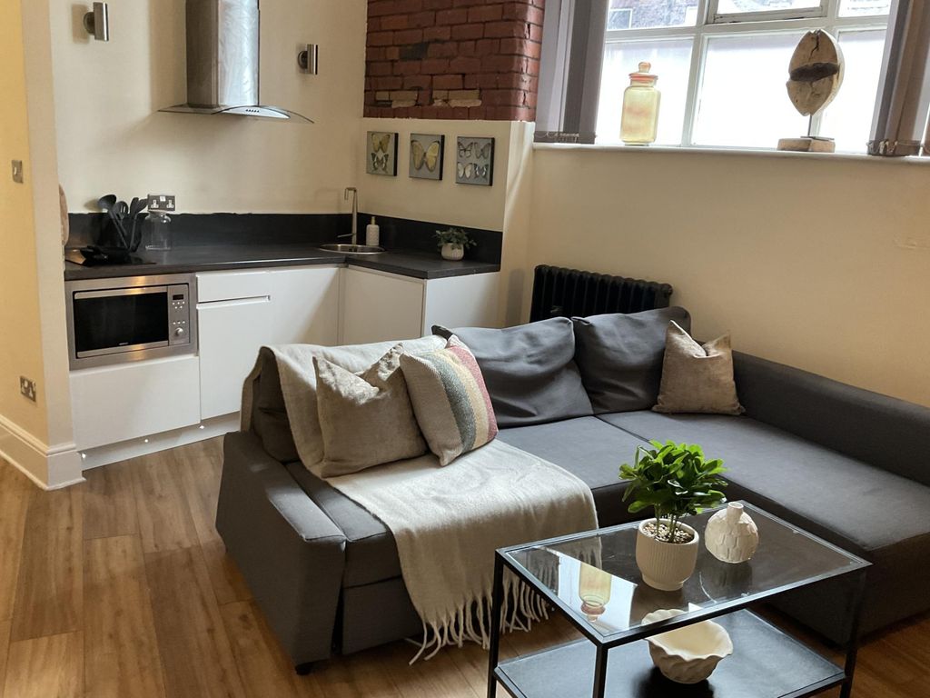 Property photo 3 of 16 A Cozy And Modern Living Room Featuring A Comforta...