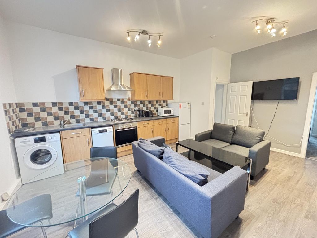 Property photo 3 of 14 A Modern, Well-Lit Living Area Featuring Contempor...