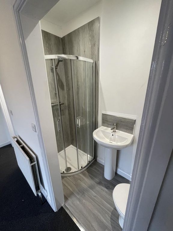 Property photo 3 of 4 A Modern Bathroom Featuring A Curved Glass Shower ...