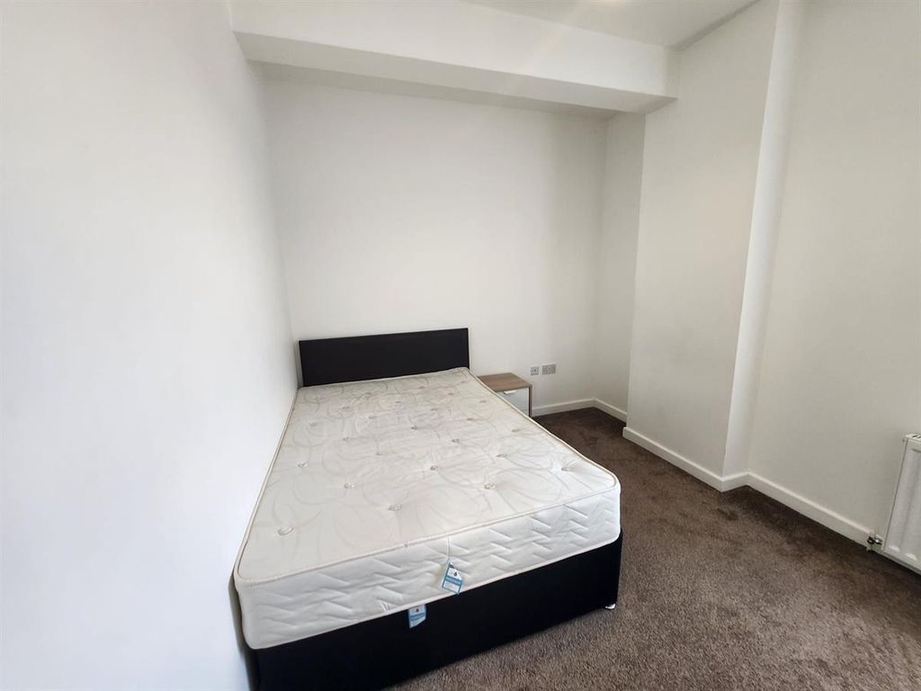 Property photo 3 of 11 A Clean And Bright Bedroom Featuring A Bed Frame A...