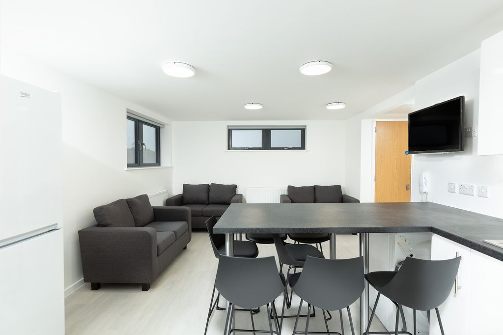 Property photo 2 of 7 A Spacious And Modern Living Room With Ample Natur...