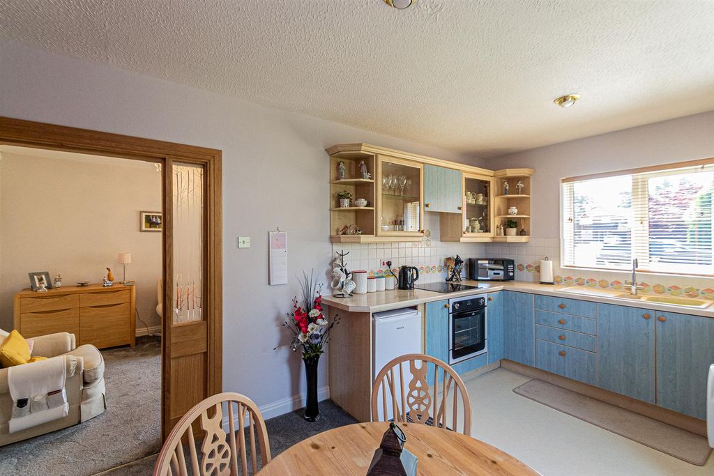 Property photo 3 of 17 Dining Kitchen