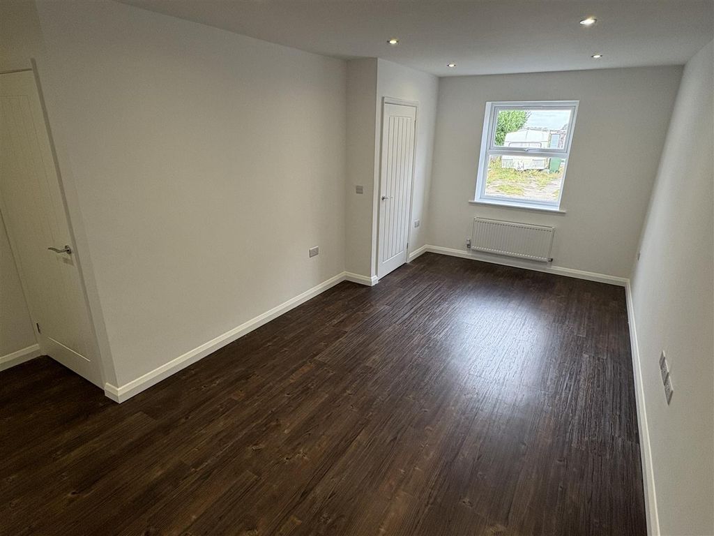 Property photo 3 of 13 Bright Modern Bedroom With Sleek Wooden Flooring...