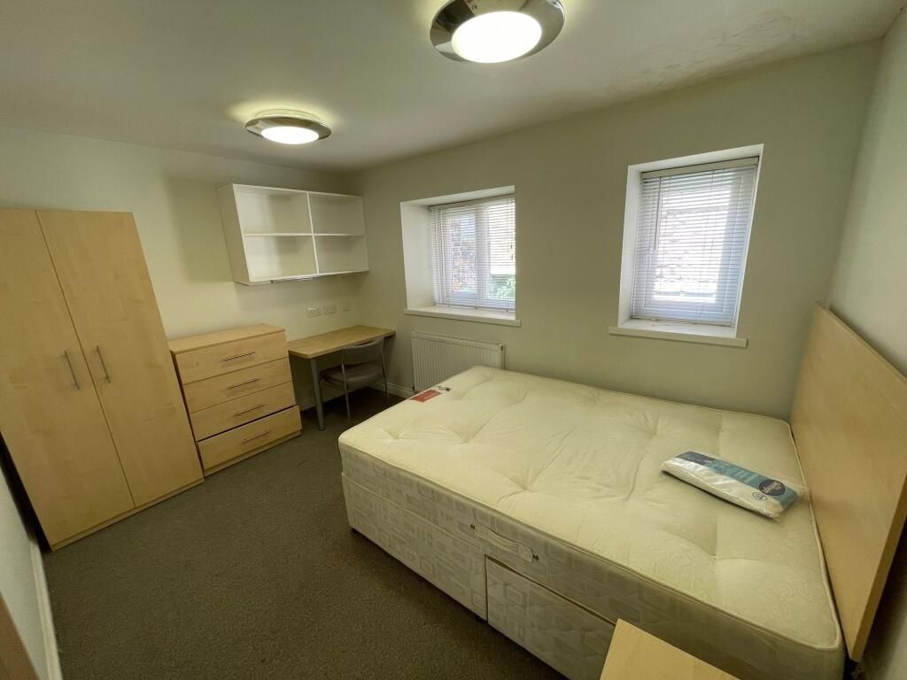 Property photo 1 of 13 A Bright And Inviting Master Bedroom Featuring A d...