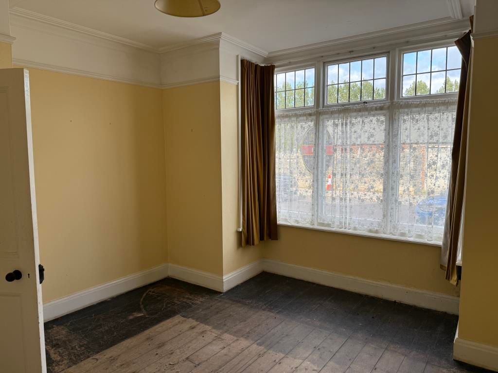 Property photo 2 of 10 Living Room With Painted Walls And Bare Flooring