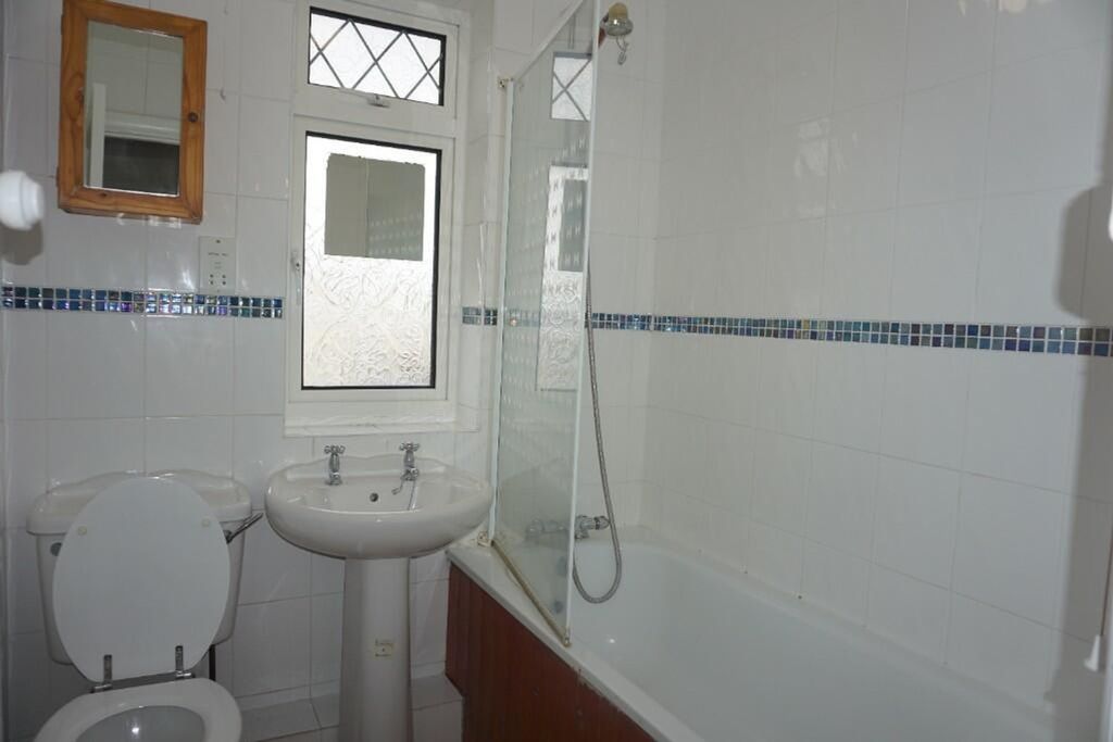 Property photo 1 of 8 A Tidy And Functional Bathroom Featuring A Bathtub...