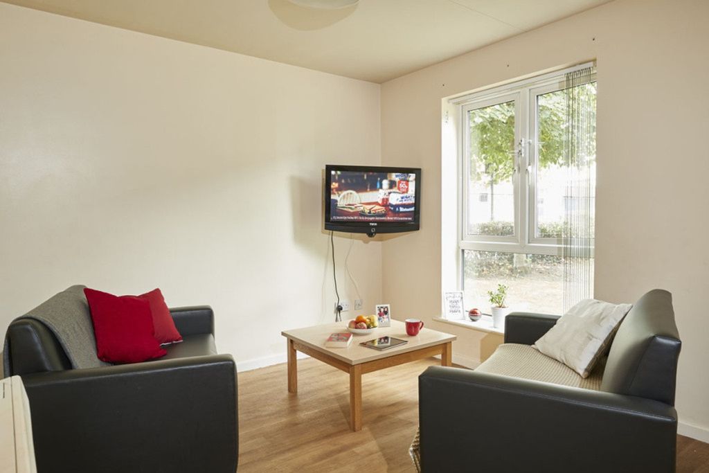 Property photo 2 of 5 A Bright And Inviting Living Room Featuring Comfor...