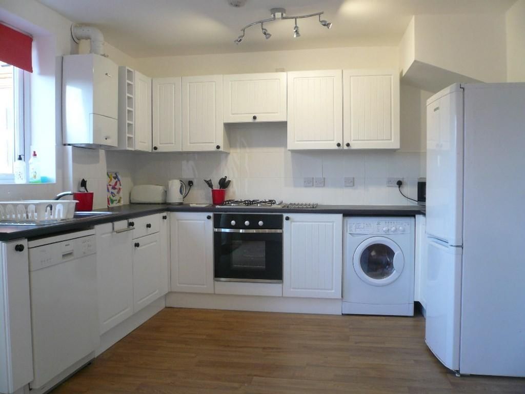 Property photo 1 of 10 A Bright And Spacious Kitchen Featuring Modern App...
