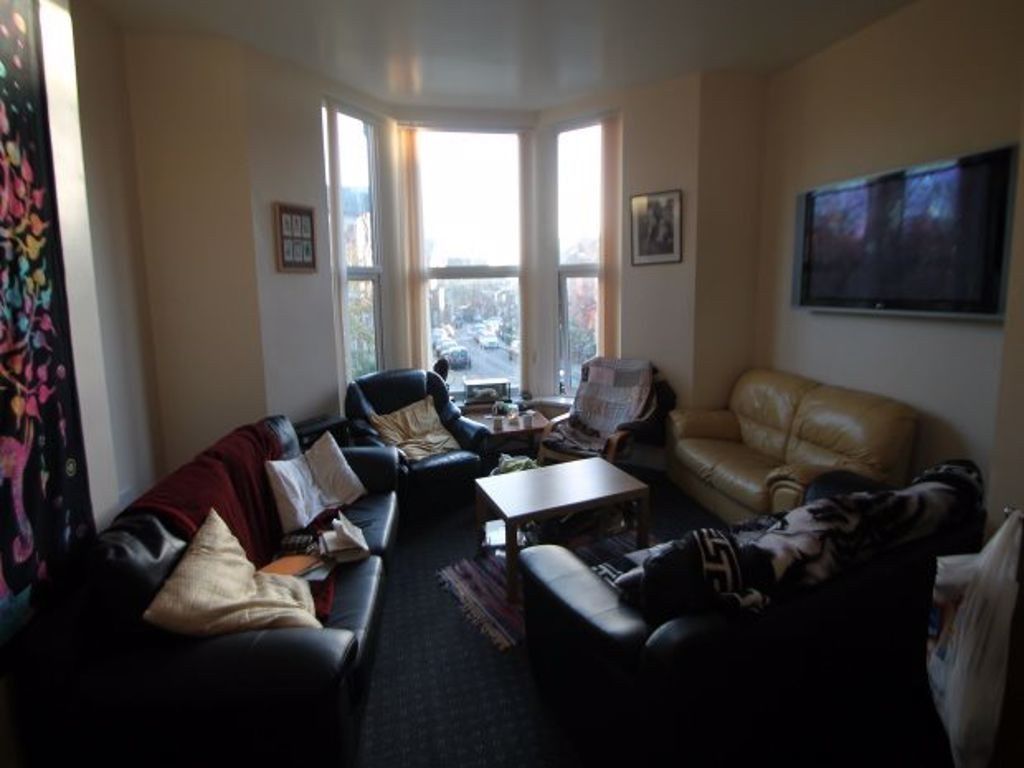 Property photo 2 of 12 A Cozy And Inviting Living Room Featuring A Large ...