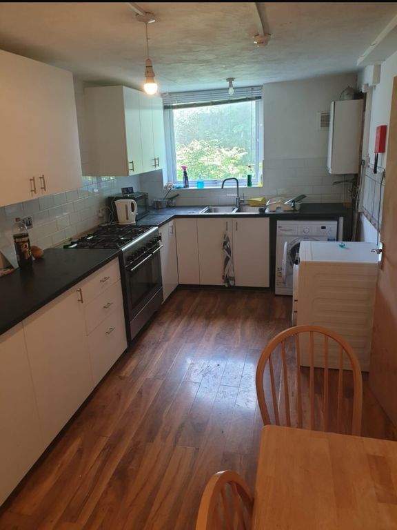 Property photo 2 of 5 A Spacious And Well-Lit Kitchen With Modern Applia...