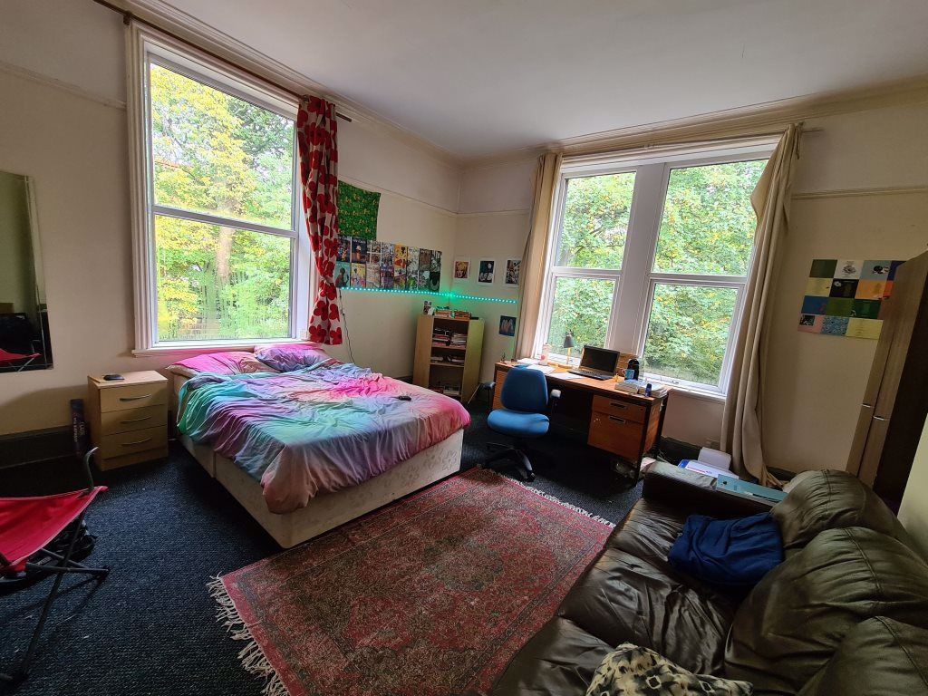 Property photo 1 of 25 Bright And Spacious Bedroom Featuring Two Large Wi...