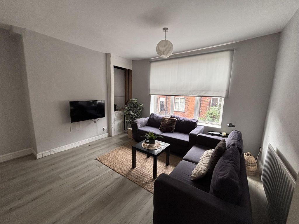 Property photo 3 of 13 A Bright And Modern Living Room With Large Windows...