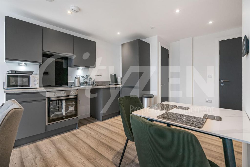 Property photo 2 of 12 Dining Area/Kitchen
