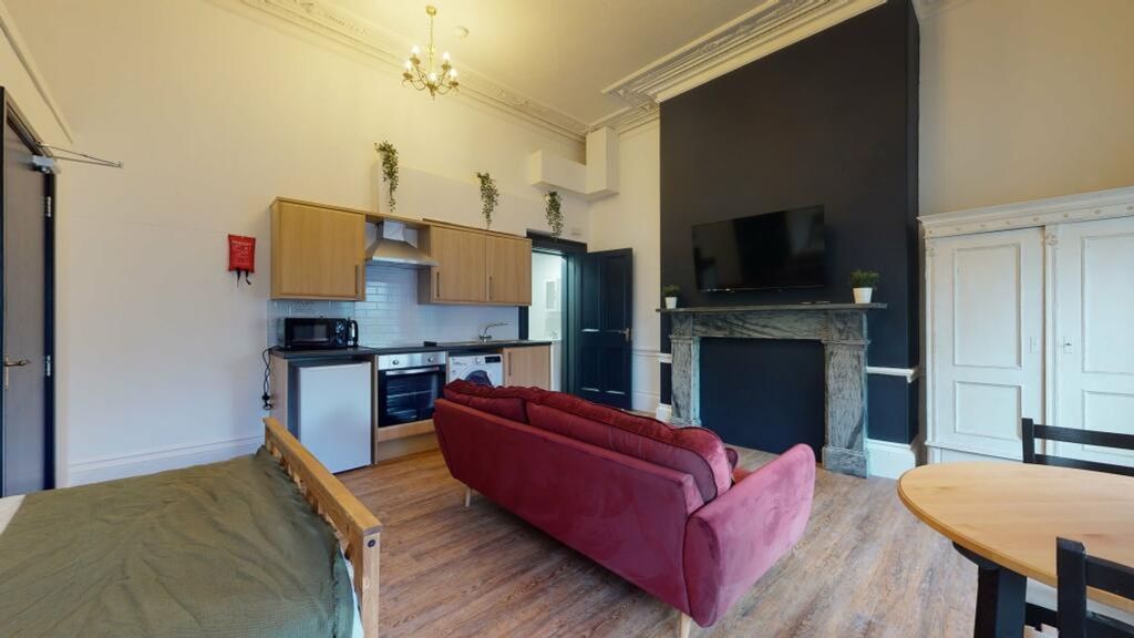 Property photo 3 of 3 A Spacious And Stylish Living Area Featuring Moder...