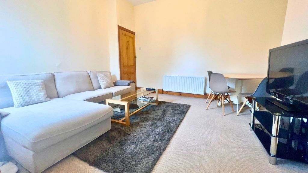 Property photo 3 of 15 A Contemporary Living Room Featuring A Spacious li...